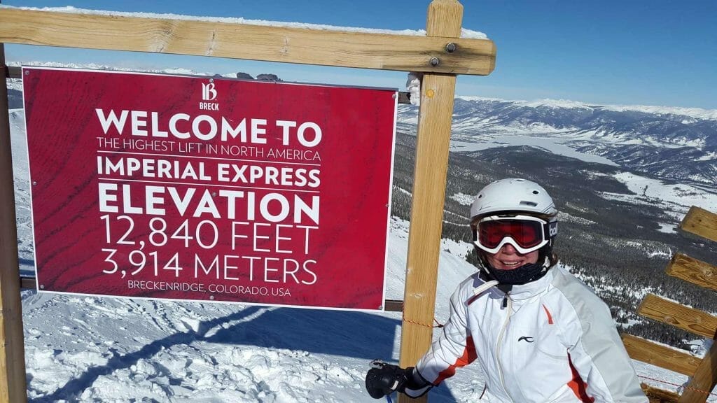 Me standing next to the elevation sign at the top of Imperial