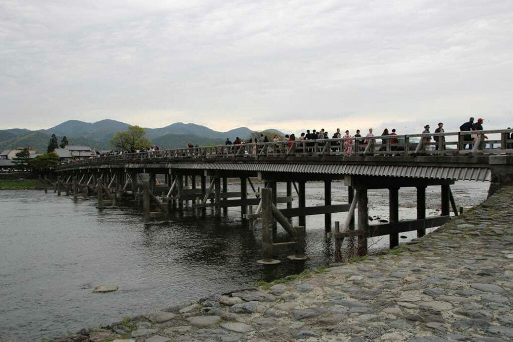 Crowds crossing the Togetsu-kyo Bridge at Arashiyama