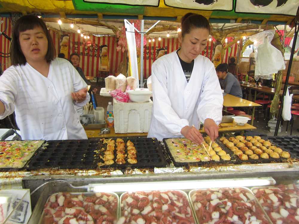 Making tokiyaki at street food stall