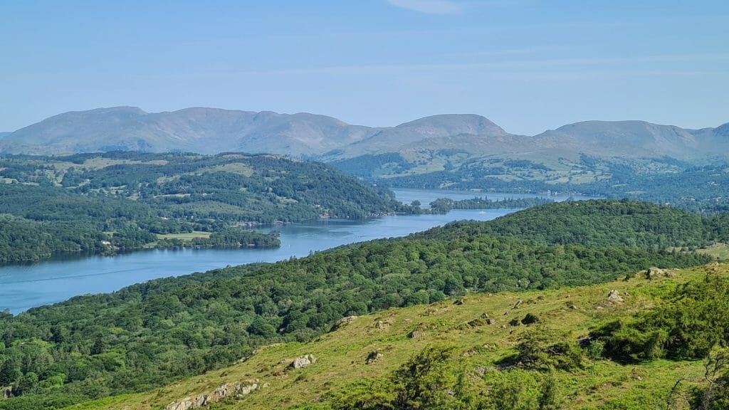 View over Windermere with mountains in distance on a day trip to the Lake District