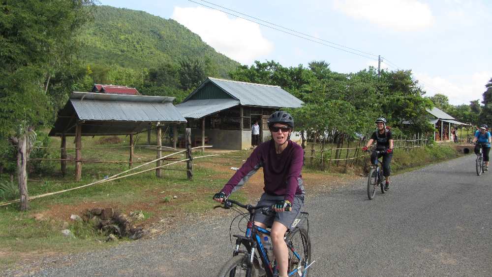 Jane on bike on Cambodia by bike trip
