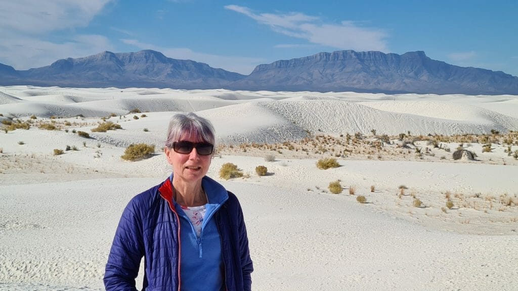 Jane standing on white sand on visit to White Sands National Park