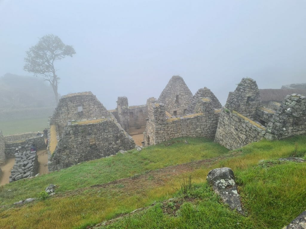 Buildings within Machu Picchu in fog