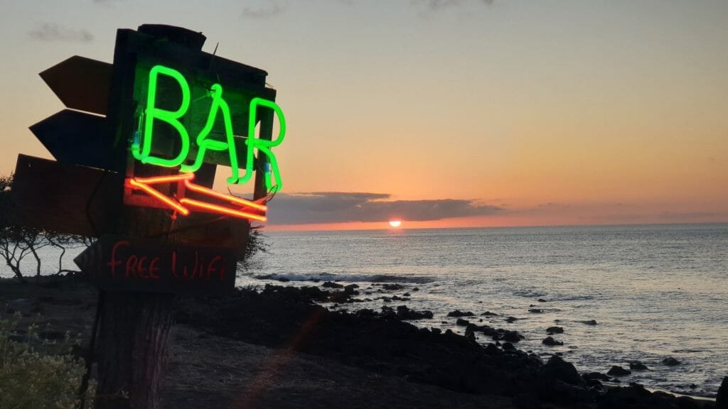 Bar sign with sunset behind on Floreana Island on trip to the Galapagos Islands