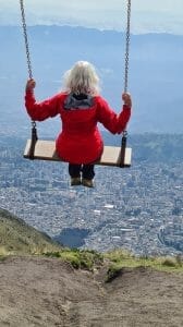 Jane on swing above Quito for is it worth visiting Quito?