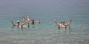 Three girls enjoying swimming in the Dead Sea