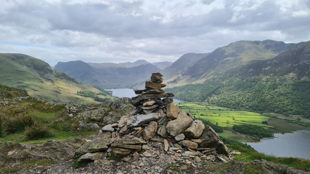 Stone cairn with lake in background