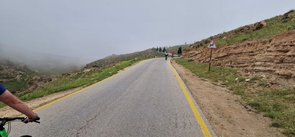 Cyclists cycling uphill to Machaerus