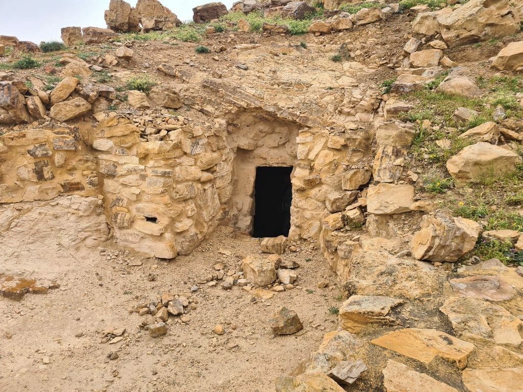 Doorway into cave in hillside at Machaerus