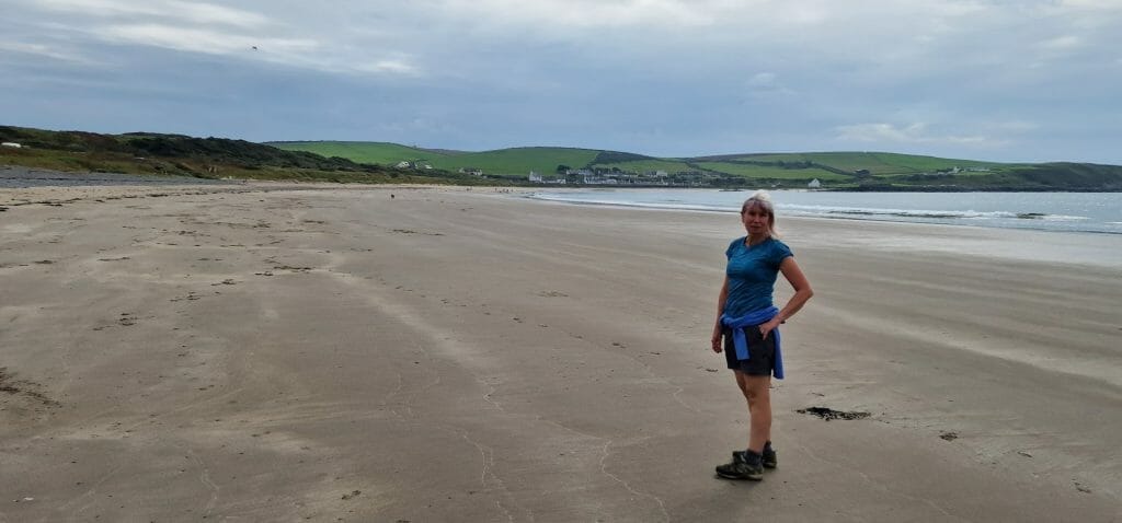 Jane on empty sandy beach