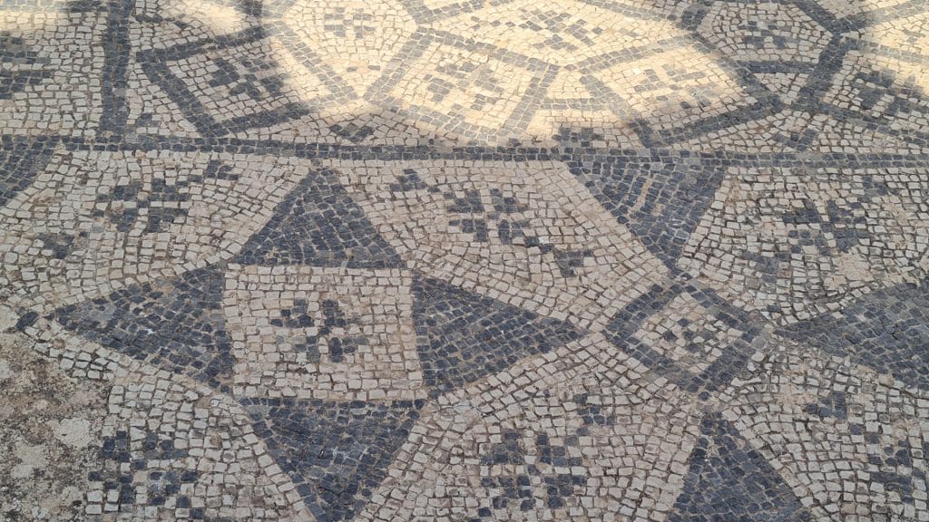 Black and white tiles in floor mosaic